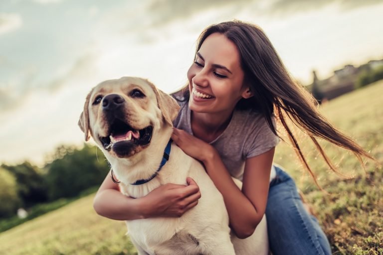 loving pet owner with her adopted dog